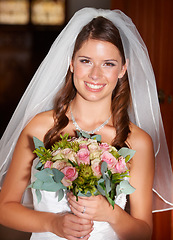 Image showing Happy woman, portrait and bride with bouquet of roses on wedding day, marriage or commitment at church. Face of attractive female person, wife or fiance just married with flowers at bridal ceremony