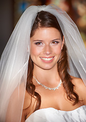 Image showing Happy woman, face and bride smile for wedding day, marriage or commitment at indoor church. Attractive female person, wife or fiance getting married with stylish veil in beauty at bridal ceremony