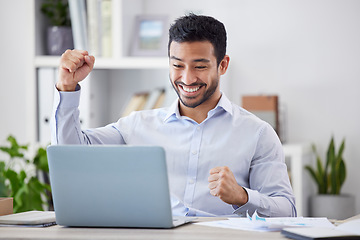 Image showing Asian man, success fist and laptop by desk with happy, stock market deal and investment portfolio growth in office. Profit, winner hands and smile by computer with technology and online with cheering