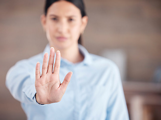 Image showing Business woman, hand and stop for protest, wait or halt with no gesture or take a stand at office. Closeup of female person or employee showing palm for negative sign or disapproval at workplace