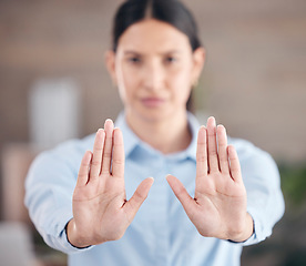 Image showing Business woman, hands and stop for wait, no or halt in gesture, protest or take a stand at office. Closeup of female person or employee showing refuse for negative sign or disapproval at workplace