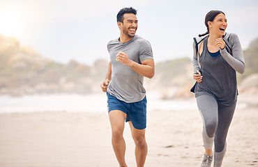 Image showing Couple of friends, running and training on beach for fitness, workout and excited or happy for cardio, race or support. Excited woman, man or personal trainer by sea and outdoor for exercise health