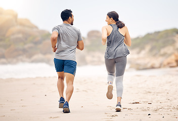 Image showing Couple of friends, running and workout on beach for fitness, training and accountability with cardio, race or support. Back of people, athlete or runner by ocean, sea and outdoor for exercise health