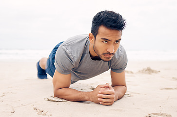 Image showing Asian man, plank and beach for exercise, workout or outdoor training on strong core or abs. Active male person, athlete or bodybuilder planking on sand by ocean coast in fitness, health and wellness