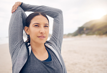 Image showing Woman, fitness and stretching arms on beach getting ready for workout, exercise or outdoor training. Active female person, athlete or runner in body warm up, stretch or preparation by ocean coast