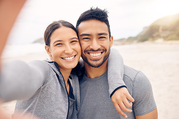 Image showing Happy couple, beach and selfie in fitness for photography, memory or outdoor workout together. Portrait of man and woman smile in photograph, picture or social media vlog on ocean coast for exercise