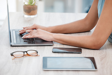 Image showing Hands, laptop and a business woman at a desk in her office for communication, networking or report. Phone, tablet and glasses with an employee typing an email closeup in a professional workplace