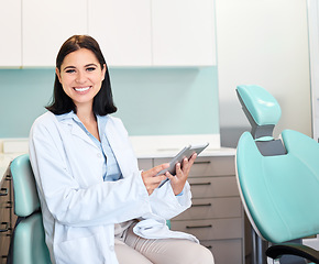Image showing Smile, tablet and portrait of woman dentist with confidence in her office doing research at clinic. Happy, medical and young female orthodontist or dental doctor with digital technology in hospital.