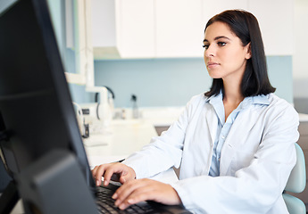 Image showing Scientist, woman and computer for research, laboratory test results or typing information in healthcare or medical study. Professional doctor or expert with science report on desktop or database