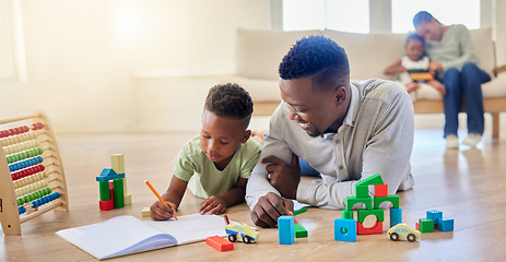 Image showing Family, man and boy with book for learning in home for child growth, development or milestone. Black person, kid and together for toys by education, teaching or motor skill by lying, floor and lounge