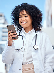 Image showing Doctor, happy woman and phone for medical chat, social media and reading online information outdoor at hospital. African worker in healthcare with mobile for telehealth service, FAQ or clinic contact