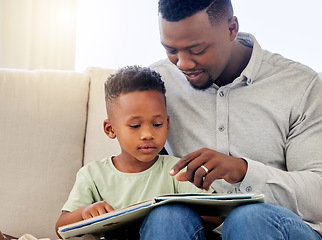 Image showing African, father and child in home reading book on sofa with development of education, learning and knowledge. Happy dad, teaching and show kid a story in books and relax in living room on couch