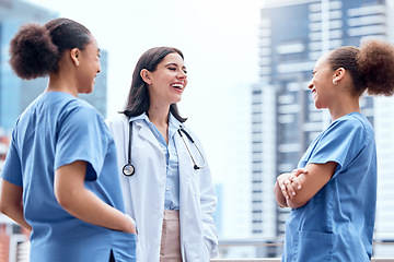 Image showing Medical, doctor and nurse outdoor with laughing for support, trust and collaboration at hospital. Healthcare, professional and women with teamwork, happy and confident for surgery or internship work