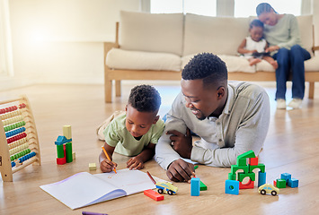 Image showing Family, man and boy with book on floor, lying and living room with love, care and support for education. Father, son and together with toy, blocks or pen for child development, growth or learning