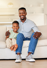 Image showing Happy, smile and portrait of child with father on sofa in the living room of modern house for bonding. Care, love and young African boy kid sitting with his dad on couch of lounge at home together.