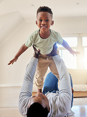 Image showing Airplane, happy and portrait of child with father in the living room of modern house having fun. Smile, love and young African boy kid playing with his dad on the floor of the lounge at home together