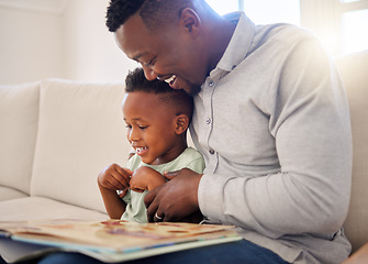 Image showing African, father and child in home reading book on sofa with development of language, education and learning. Happy dad, teaching and show kid a storytelling in books and relax in living room on couch