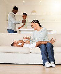 Image showing Mother, child and tickle on couch, play and bonding together at home, fun and care in living room. Black family, daughter and love in connection, comedy and silly or goofy, laughing and happiness