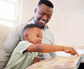 Image showing African, father and child in home reading book on sofa with development of language, education and learning. Happy dad, teaching and show kid a storytelling in books and relax in living room on couch