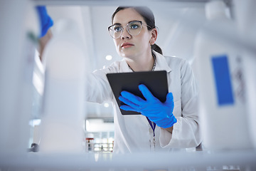 Image showing Woman, medical scientist and tablet in lab for test results check, future trial or science solution. Female person, digital device and thinking or review breakthrough hope, idea in biotechnology