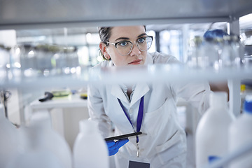 Image showing Tablet, scientist and medical bottles in laboratory for healthcare research and medicine container with vaccine. Woman, glasses or doctor for pharmaceutical analysis or science of chemistry inventory