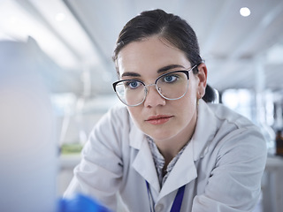 Image showing Woman, scientist and lab study future medicine for research discovery, vaccine technology or results review. Female person, glasses and thinking breakthrough for antibiotic, help pills or innovation