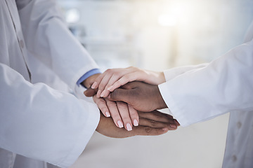 Image showing Hands, teamwork and doctors in the hospital for unity or solidarity in medicine or healthcare. Medical, support or motivation with health professionals closeup in a clinic for treatment goals