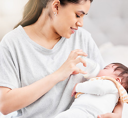 Image showing Mother feeding baby milk, nutrition and bottle with early childhood development, meal and family with wellness, healthy and bonding. Child is drinking, home and mama with infant, love and care