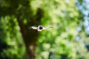 Image showing Professional drone filming the park on a sunny day