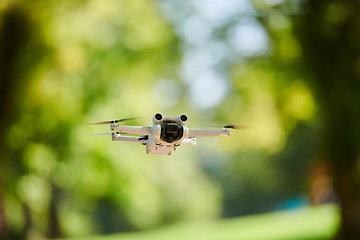 Image showing Professional drone filming the park on a sunny day