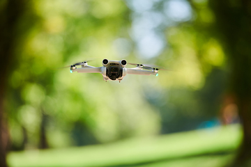 Image showing Professional drone filming the park on a sunny day