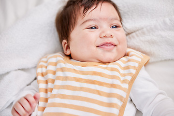 Image showing Kids, face and baby on a bed with a smile, playing and curious in a nursery room. Children, happy little girl in a bedroom for child development, morning or learning games after waking up playful