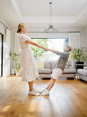 Image showing Mom, dance and holding hands with child in home, living room or lounge with trust, support or balance. Mother, love and care for kid in house and moving to music, song or listening to radio together