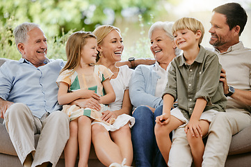 Image showing Love, smile and a big family on a sofa in the living room of their home together during a visit. Happy, trust or support with young children, parents and grandparents bonding in an apartment