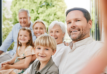 Image showing Love, selfie and a big family on a sofa in the living room of their home together during a visit. Portrait, photograph or memory with happy children, parents and grandparents bonding in an apartment