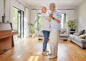 Image showing Love, dance and a senior couple in the living room of their home together for retirement bonding. Smile, trust or holding hands with an elderly man and woman moving in their apartment for romance
