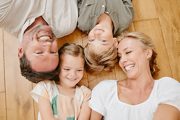 Image showing Family, floor and above of parents and kids with smile for bonding, relationship and relax at home. Happy, laugh and top view of mother, father and children in living room for love, care or childhood