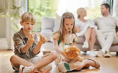 Image showing Brother, sister and sibling children with toys on the floor of a living room in their home together. Family, cute boy and girl kids playing in their apartment with parents for weekend bonding