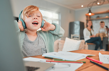 Image showing Child, headphones and homework or music sing at laptop for distance learning, virtual class or notebook. Kid, academic work break in family home for entertainment playlist, relax or education rest