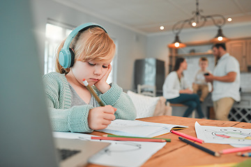 Image showing Girl, writing and book with headphones for elearning, study or homework in living room or table at home. Young female person, kid or child taking notes or homeschool with headset for online learning