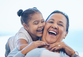 Image showing Love, hug and happy child, grandmother and young girl support, care or smile with trust and relax grandma. Blue sky, family hugging and senior face of old woman bonding, freedom and laughing with kid