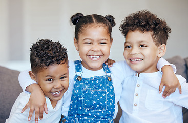 Image showing Sibling, children and hug with smile in portrait on sofa in living room for memory, milestone or growth. Boy, girl or happiness on face for bond, relationship or care with embrace for love in support