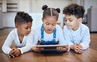 Image showing Children, youth and tablet on floor in home with app, entertainment and internet. Siblings, little girl and boy with technology for learning, together or bonding in childhood with online, game or web