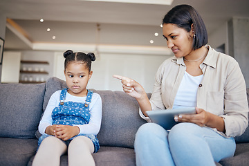 Image showing Mom, child and scolding or discipline, tablet and punishment for technology. Parent and daughter, communication and disappointed for cyberbullying, bad behaviour and frustrated for digital mistake