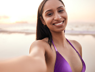 Image showing Selfie, happy and portrait of woman by beach for summer holiday, vacation and relax on weekend. Travel, swimsuit and face of person take picture for social media, online post and memory by ocean