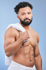 Image showing Shower towel, studio portrait and man confident in morning routine, body cleaning or self care maintenance. Bathroom skincare, grooming wash and model hygiene, beauty and dry skin on blue background