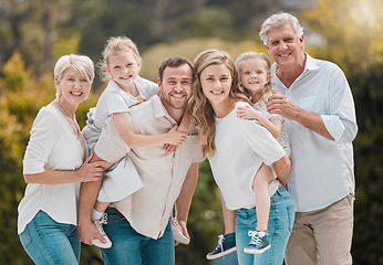 Image showing Portrait of grandparents, parents and kids in park with smile, big family and piggy back in backyard. Nature, happiness and men, women and children in garden with love, support and outdoor bonding.