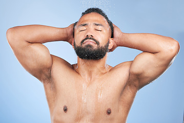 Image showing Bath water, shower and man wet, grooming and morning self care maintenance, bathroom body cleaning or spa salon wellness. Skincare liquid wash, eyes closed or studio person hygiene on blue background