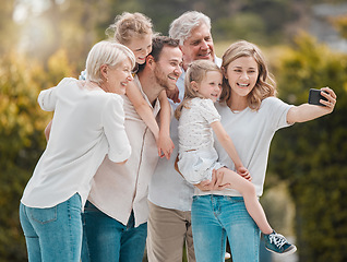 Image showing Selfie of big family in garden together with smile, grandparents and parents with kids in backyard. Photography, happiness and men, women and children in park with love, support and outdoor bonding.