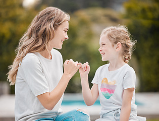 Image showing Smile, swear and mother with girl, promise and relax with happiness, bonding and commitment link. Family, mama and child with hand gesture, pinky and love in a park, secret and support with trust